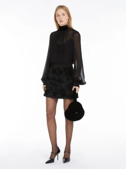 Blusa dolcevita in georgette