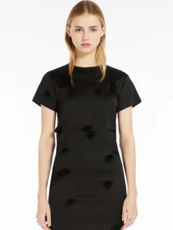 Top aderente con rose ricamate
